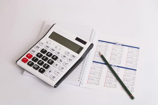 Calculator on the calendar isolated — Stock Photo, Image