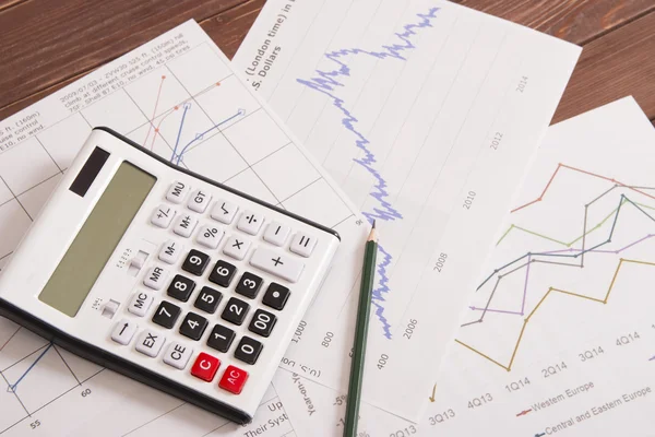 Financial reports and calculator — Stock Photo, Image