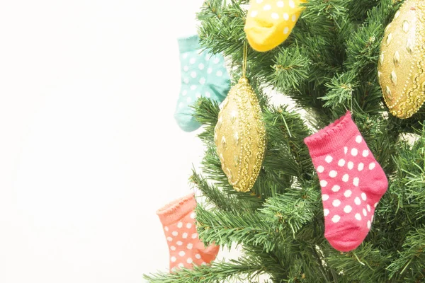 Christmas tree and stockings — Stock Photo, Image
