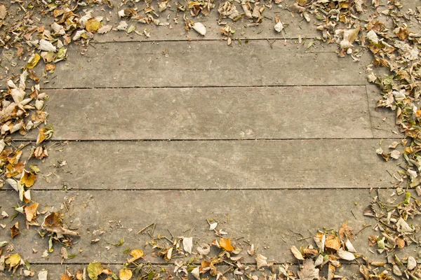 Fondo de madera y hojas secas —  Fotos de Stock