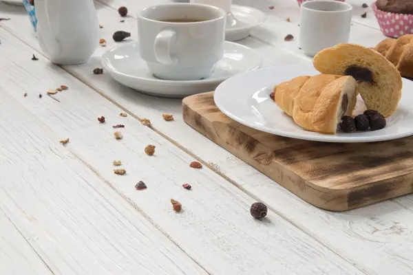 Breakfast table and croissants — Stock Photo, Image