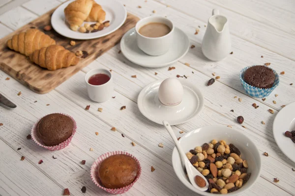 Breakfast table and croissants — Stock Photo, Image