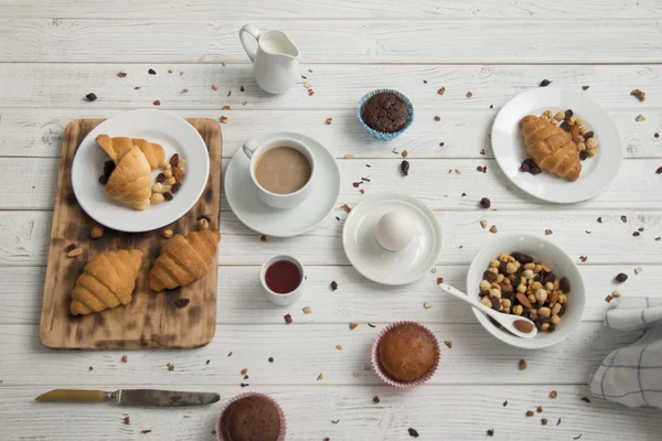 Breakfast table and croissants — Stock Photo, Image