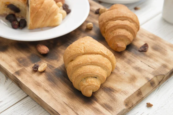 Breakfast table and croissants — Stock Photo, Image