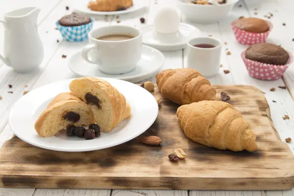 Breakfast table and croissants — Stock Photo, Image