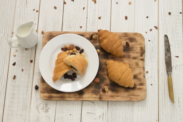 Breakfast table and croissants — Stock Photo, Image