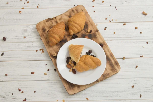 Breakfast table and croissants — Stock Photo, Image