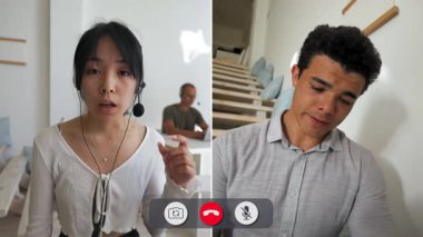 Bir adam çevrimiçi görüşme sırasında sıkılmış görünüyor. Bir kadın konuşuyor ve bir şey konuşurken el kol hareketi yapıyor. Arka plan bir ev ayarını gösteriyor.