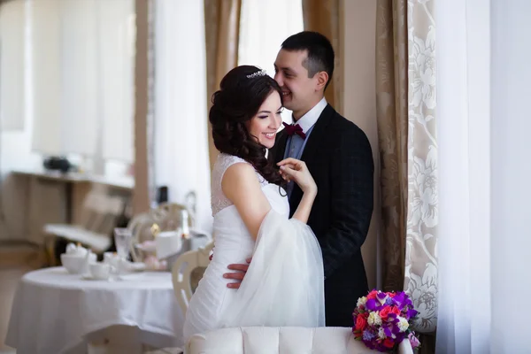 The groom kisses the bride in her head Royalty Free Stock Images