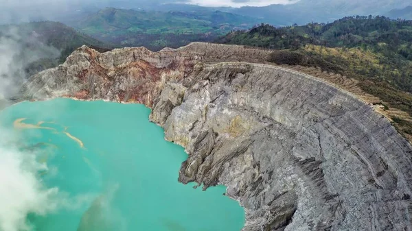 Ijen Volcano is an active volcano in Indonesia, island Java. In the heart of the volcano is not bubbling lava, but only quietly stretches turquoise lake