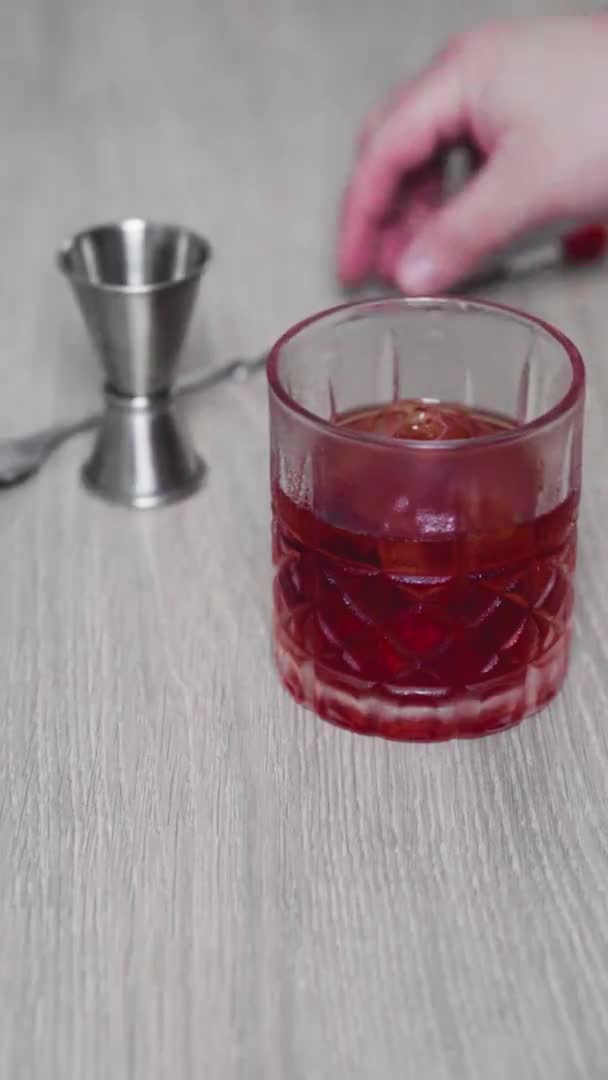 Slow Motion General Shot Glass Negroni Cocktail Out Focus Mixing — Vídeo de Stock