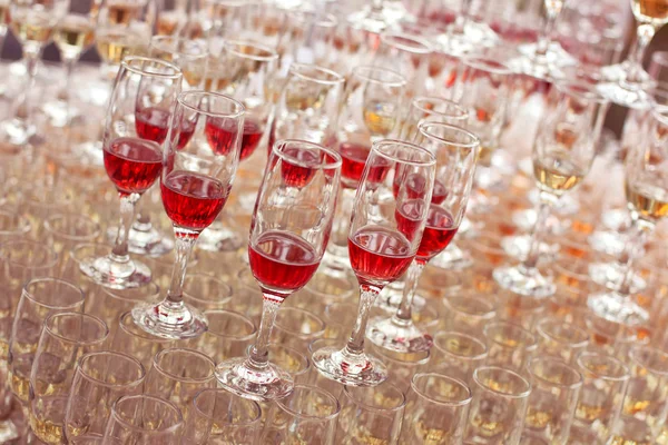 Wedding glasses filled with wine and champagne — Stock Photo, Image