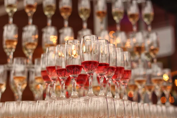 Wedding glasses filled with wine and champagne — Stock Photo, Image