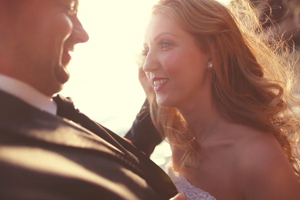 Closeup of bride and groom on the beach — Stock Photo, Image