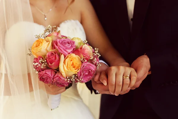 Bride holding beautiful bouquet Royalty Free Stock Images