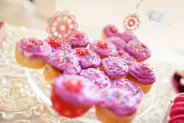 Delicious cupcakes on table — Stock Photo, Image