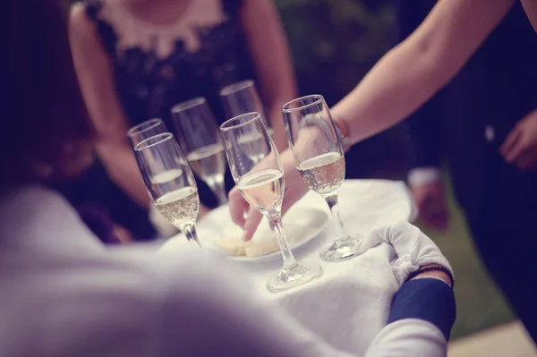 Waiter with glasses of wine — Stock Photo, Image