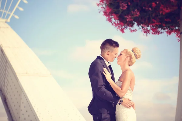 Bride and groom on a metallic bridge — Stock Photo, Image