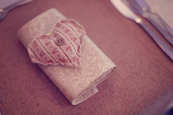 Napkin on table heart shaped — Stock Photo, Image