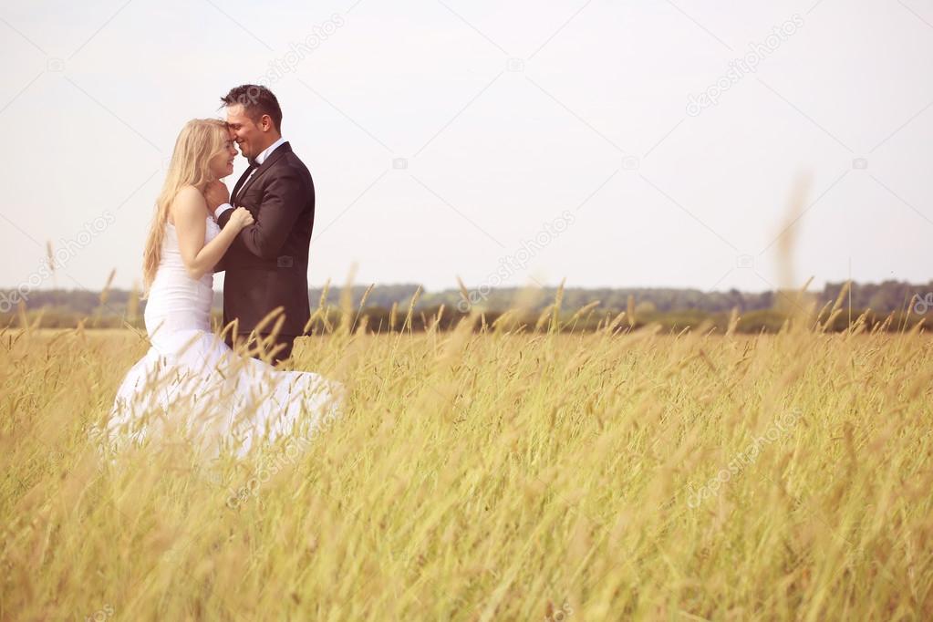 Bride and groom in the fields