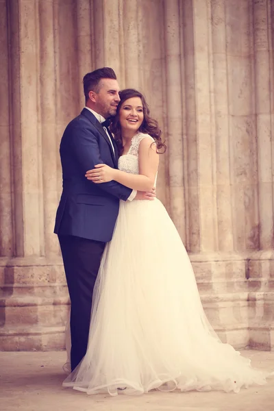 Bride and groom embracing — Stock Photo, Image