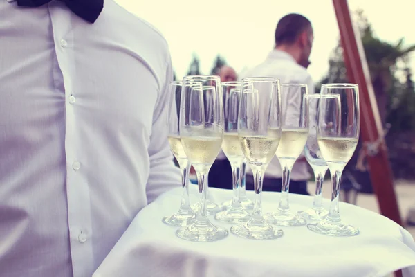 Waiter with glasses of champagne — Stock Photo, Image