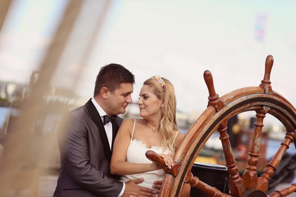 Bride and groom on a boat — Stock Photo, Image