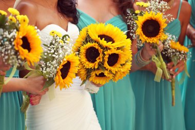 Bride and bridesmaids with sunflowers bouquet clipart