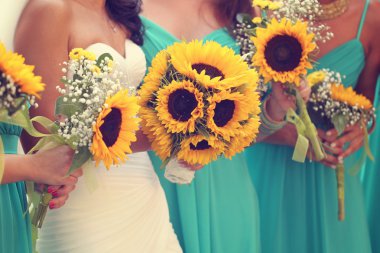 Bride and bridesmaids with sunflowers bouquet clipart