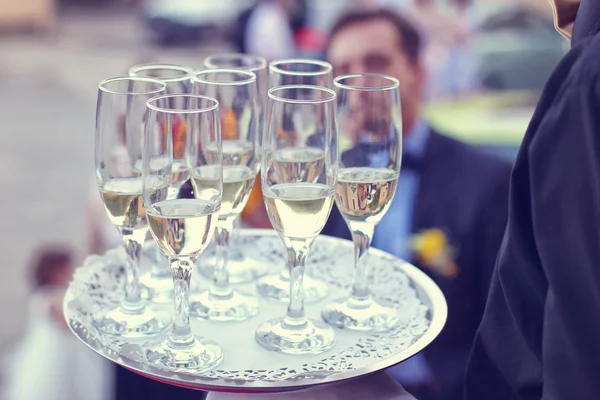 Waiter with champagne glasses — Stock Photo, Image