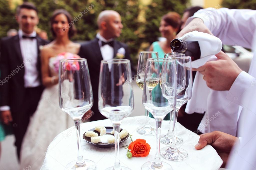 Waiter with glasses of champagne