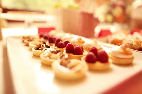 Delicious mini tarts with berries and almonds — Stock Photo, Image