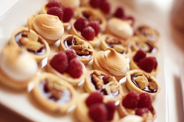 Delicious mini tarts with berries and almonds — Stock Photo, Image