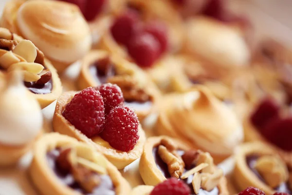 Delicious mini tarts with berries and almonds — Stock Photo, Image