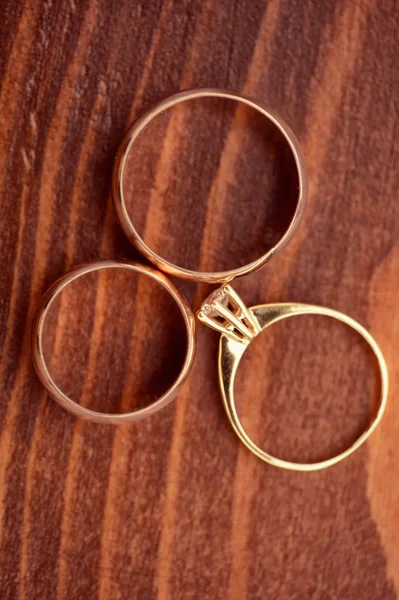 Beautiful golden engagement and wedding rings — Stock Photo, Image