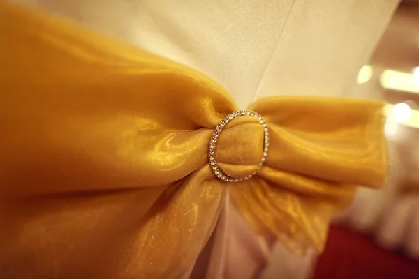 Ribbon with crystals on a chair — Stock Photo, Image