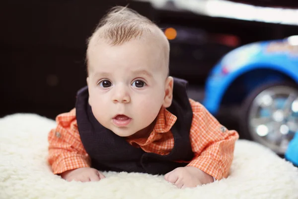 Cute baby boy on white blanket — Stock Photo, Image