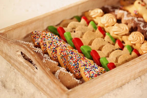 Christmas cookies on wooden plate — Stock Photo, Image