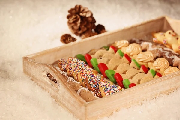 Christmas cookies on wooden plate — Stock Photo, Image