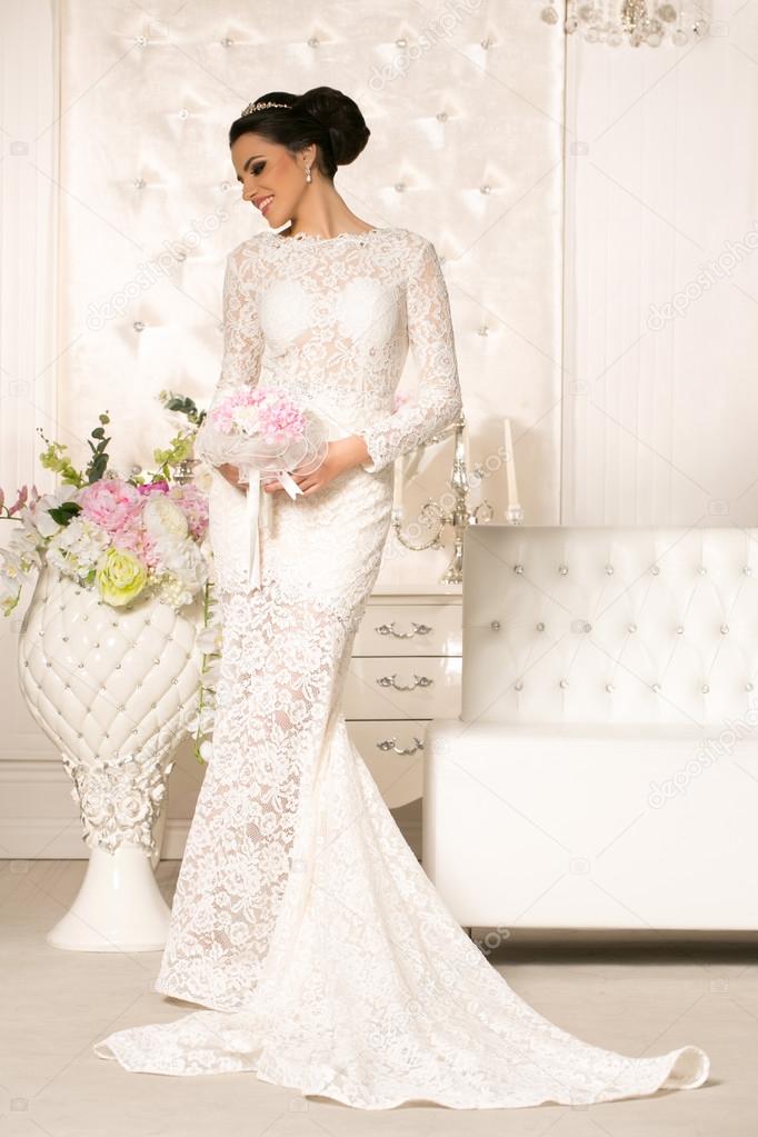 Young attractive bride in wedding dress
