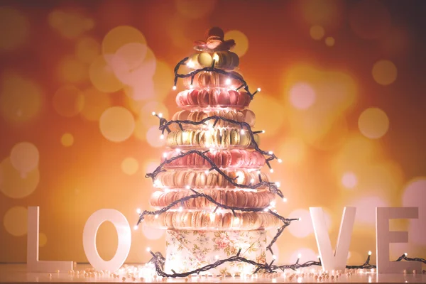 Pyramid of macaroons with lights — Stock Photo, Image