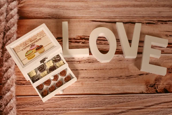 Mini chocolate sweets on a nice decor — Stock Photo, Image