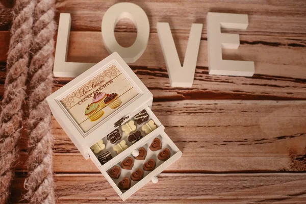 Mini chocolate sweets on a nice decor — Stock Photo, Image