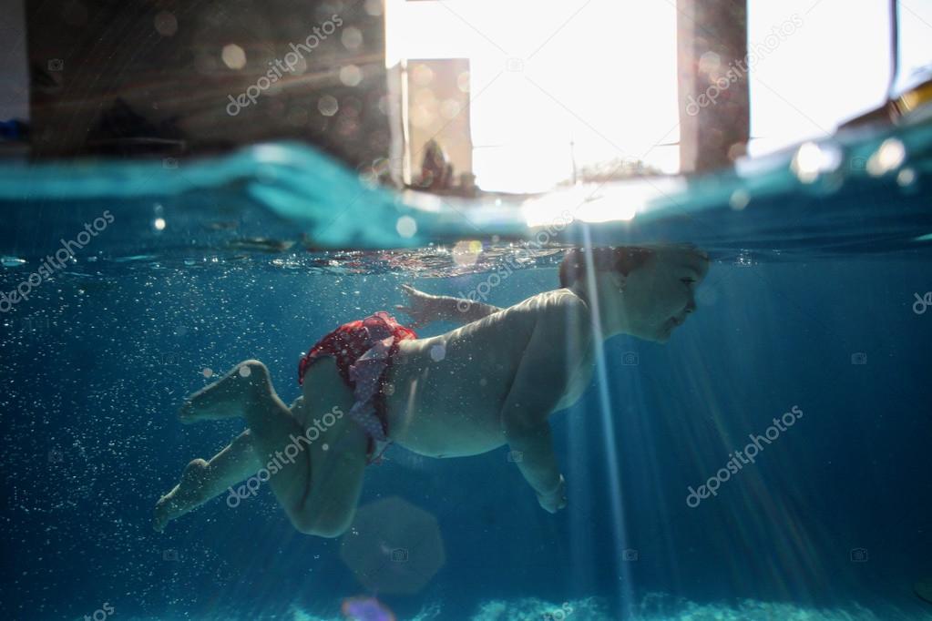 baby swimming underwater