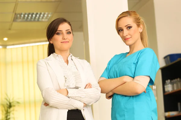 Two nurses smiling  to the camera — Stock Photo, Image