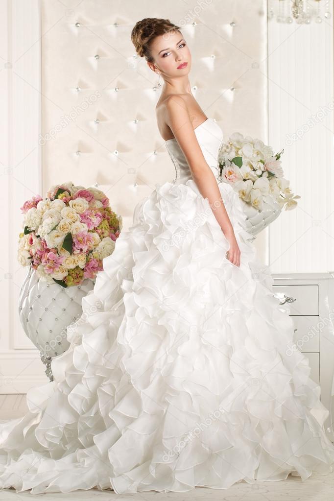 Gorgeous bride wearing a superb  white wedding dress