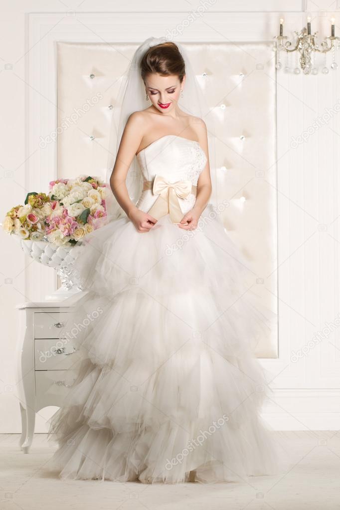 Gorgeous bride wearing a superb  white wedding dress