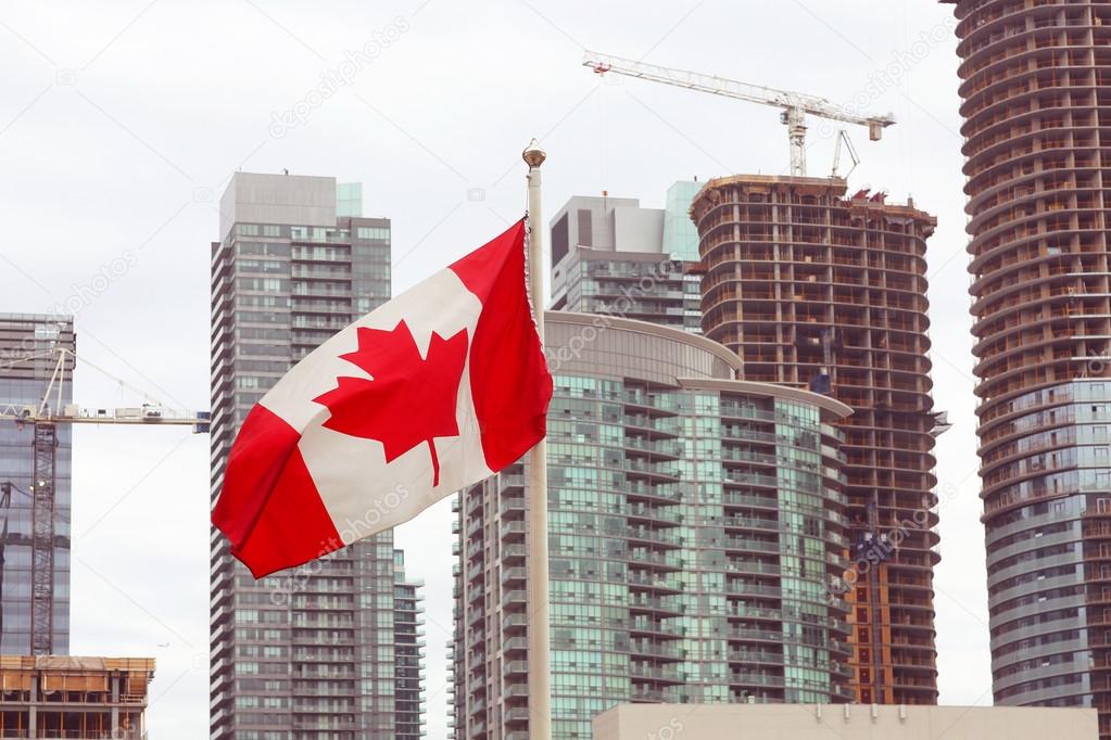 Canadian flag and Toronto city skyline