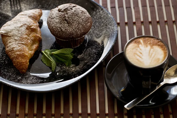 Delicious croissant and muffin with coffee — Stock Photo, Image