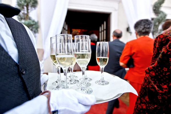 Waiter with glasses of champagne — Stock Photo, Image